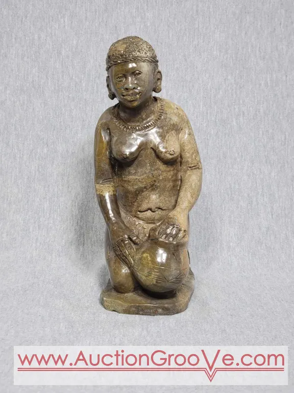 Shona Carved Statue of a Woman. Signed by the Artist. 9 x 4 x 5. A4