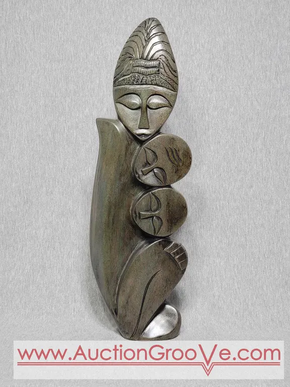 Shona Sculpture Mother and Children. 19 x 6 x 2.5. A4