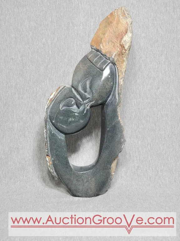 Couple Kissing. Shona Sculpture Signed by LAST. 16 x 7.5 x 3.5. A4