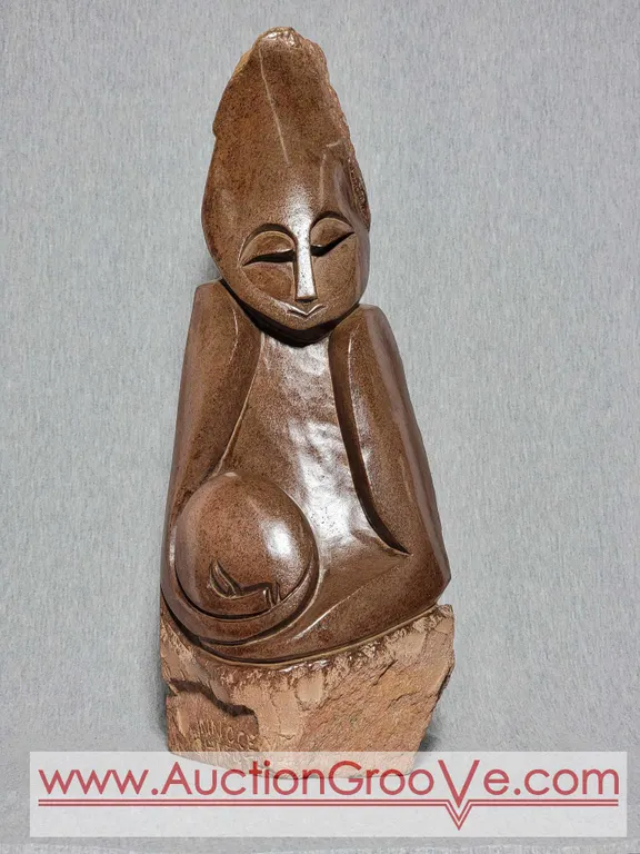 Shona Mother Cradling Child. Signed by Artist Innocent Chifutu. 16.5 x 7 x 3. B3