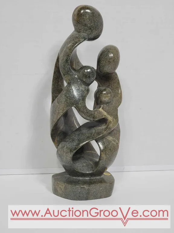 Shona Family of 4. Hand Carved in Zimbabwe. Serpentine Stone. 12 x 4 x 3" D2.