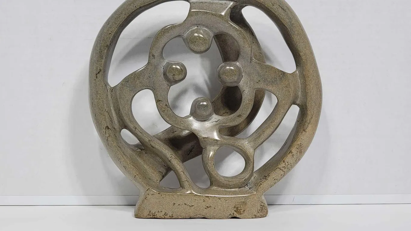 Shona Family of 4. Circle of Love. Hand Carved in Zimbabwe. Serpentine Stone. See photos. 10" x 9.5 x 2". D3.