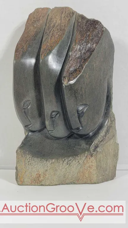 Beauty, Charm and Grace. Sculpted in Serpentine, with natural edges, and signed by the artist, Innocent Chifutu. Est. $175 - $350. D5 **NEED DIMENSI