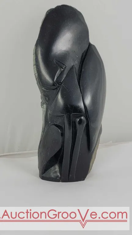 African Warrior with Spear and Shield in Springstone. This substantial sculpture measures approximately 13" x 5 x 3". Est. 150 - $300 D5