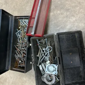 Assortment of bolts and two tool boxes
