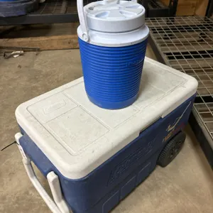 Coleman cooler and water bottle