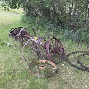 Assortment of antique axles and steel wheels