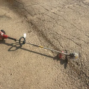 REDMAX ZENOALT WEEDEATER WITH SAW BLADE ATTACH