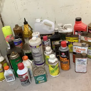 Full/part containers; jack oil, parts cleaner, cooling system stop leak, 2-stroke engine oil, Diesel 911, Gator Gold, brake fluid, etc.