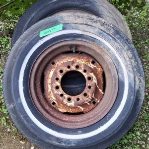 2 tires on rims. (1 is E78-14)