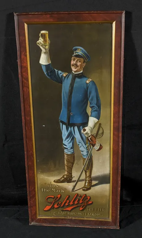 PRE PRO TIN LITHO SIGN "HITS THE MARK" SCHLITZ THE BEER THAT MADE MILWAUKEE FAMOUS