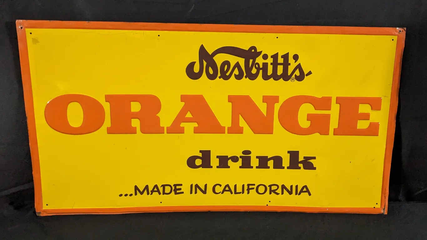 EMBOSSED TIN SIGN NESBITT'S ORANGE DRINK MADE IN CALIFORNIA