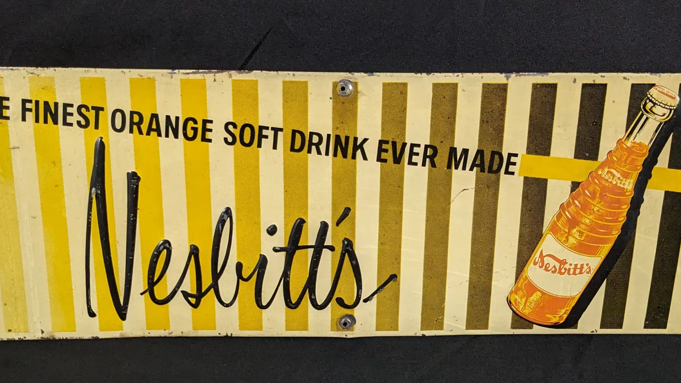 EMBOSSED TIN SIGN THE FINEST ORANGE DRINK EVER MADE NESBITT'S