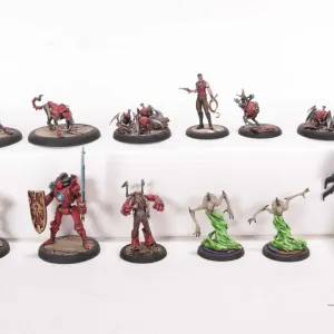 Twelve painted tabletop war gaming figures, possibly Malifaux, but not confirmed.