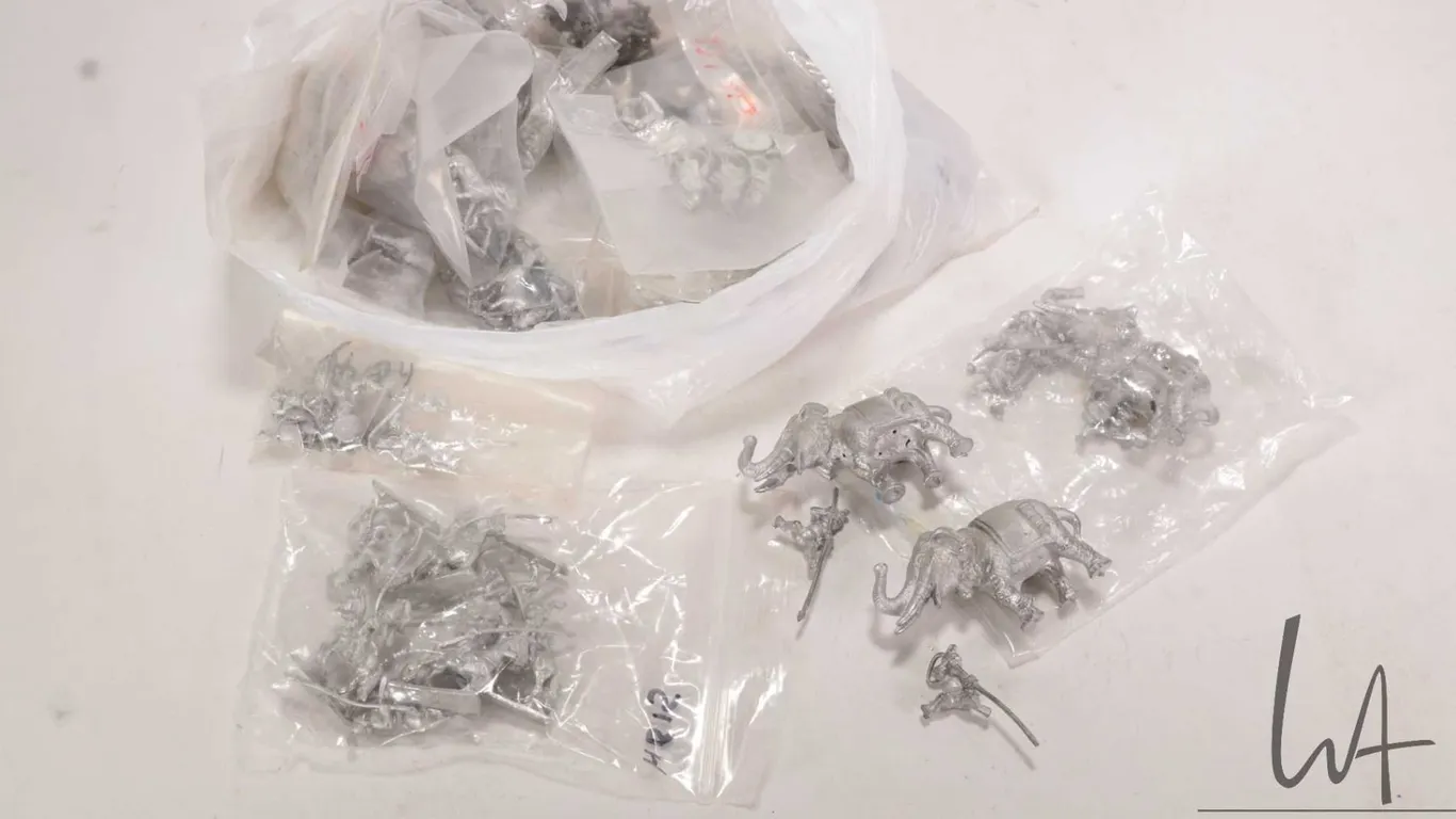 Large selection of metal miniatures including Roman soldiers, Indian elephants, horses, riders and w