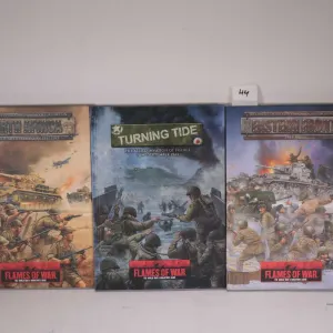Three Flames of War hardcover gaming books including "Eastern Front", "Turning Tide" and "North Afri