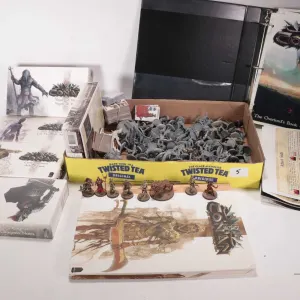 Selection of Conan game pieces, tokens and paintable figures, includes what appears to be game instr