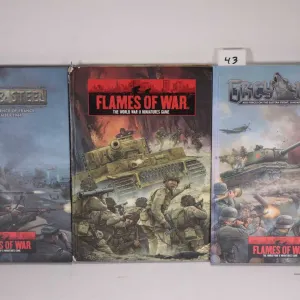 Three Flames of War hardcover gaming books including "Grey Wolf", "The World War II Miniatures Game"