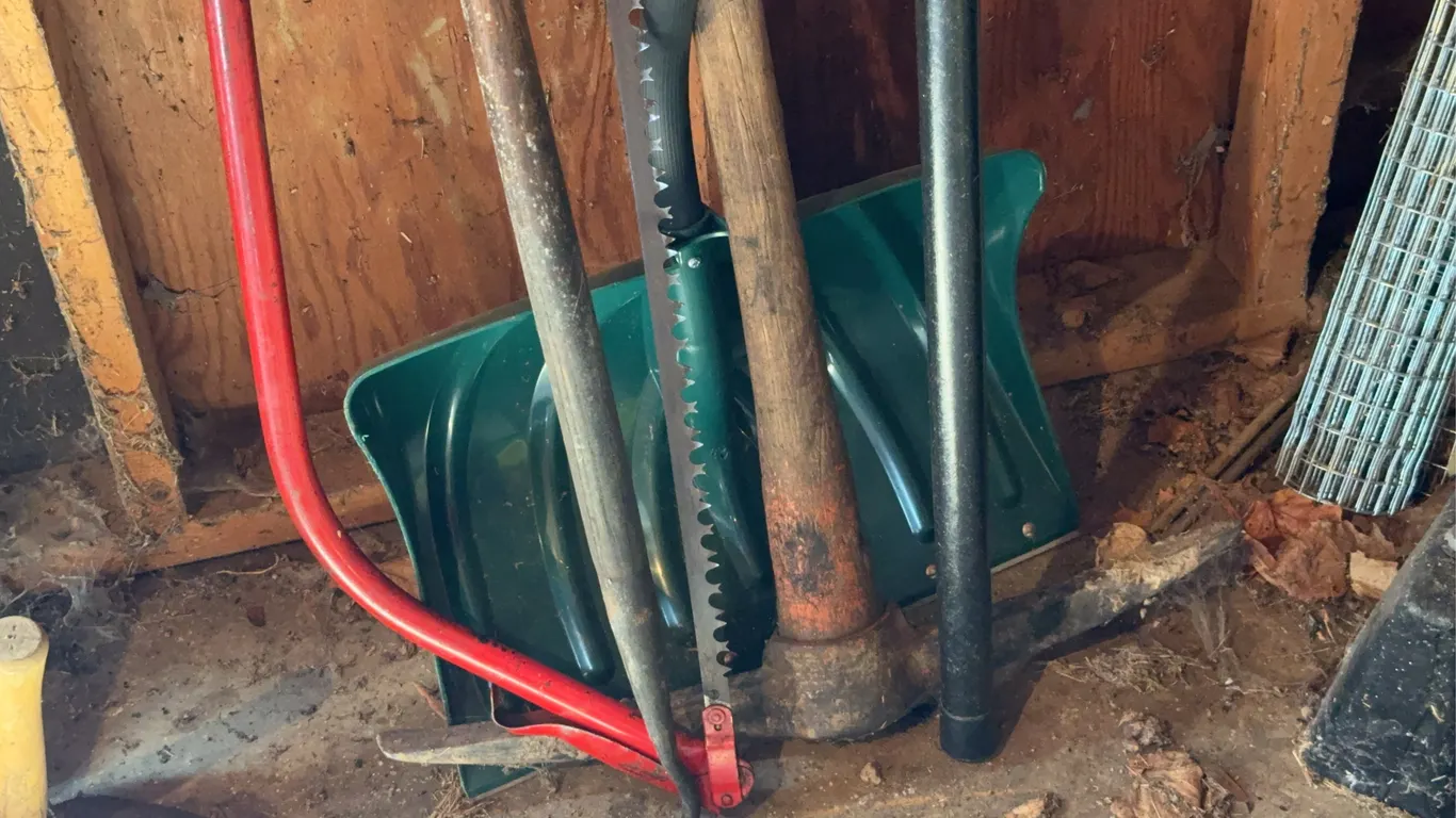 Assorted Garden Tools Including Bow Saw Pickaxe Snow Shovel Pole Pruner
