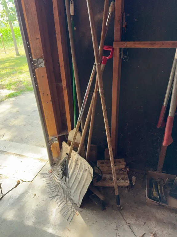 Assorted Lawn and Garden Hand Tools Including Shovel and Leaf Rake
