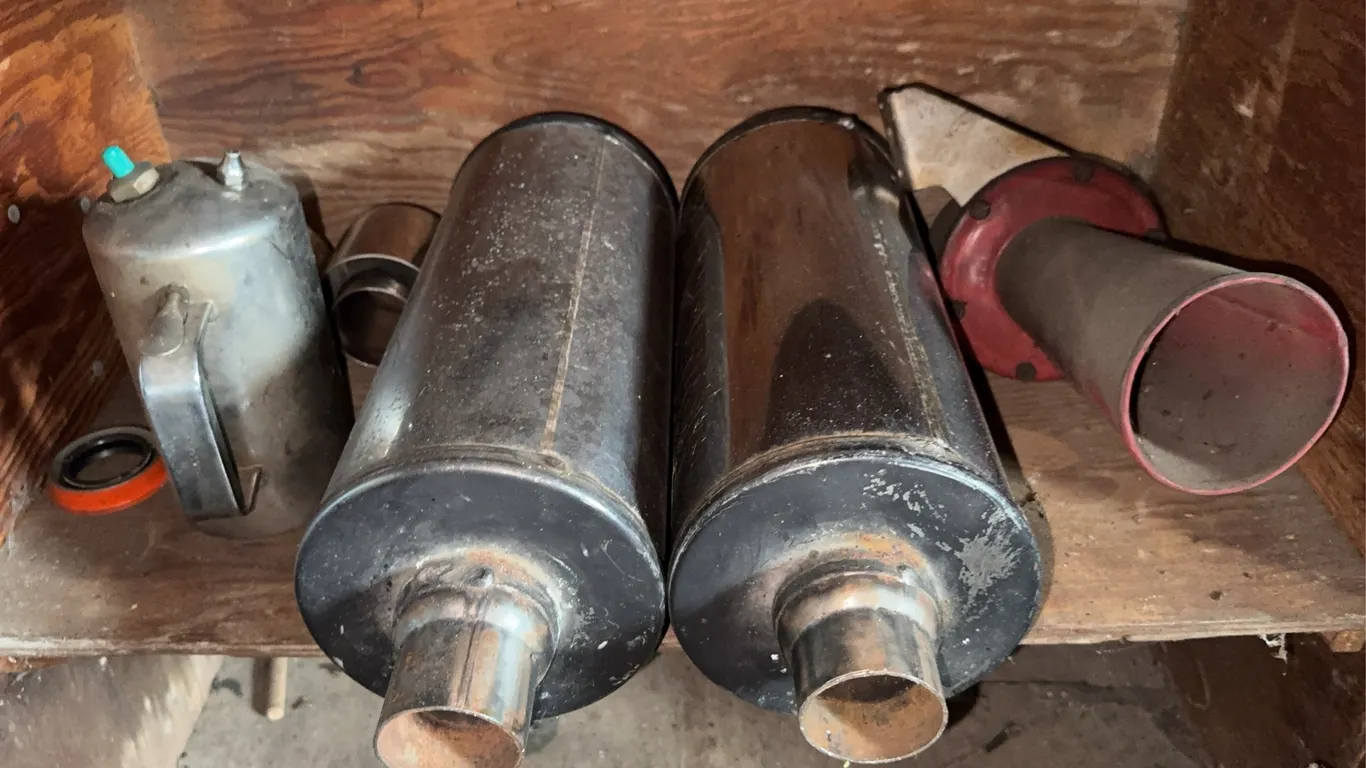 Automotive Parts Lot Mufflers Exhaust Tips Horn and Sprayer