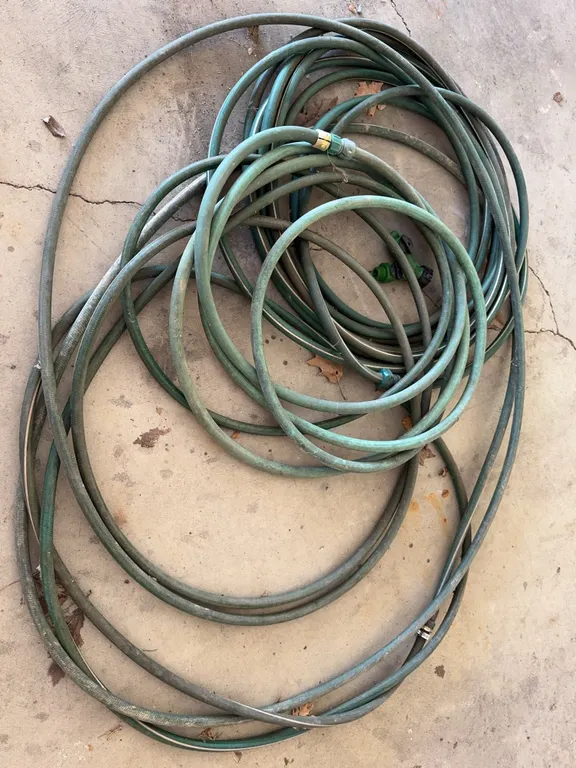Coiled Green Garden Hose Lot With Plastic Two Way Y Splitter