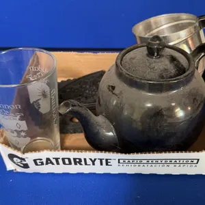 Mixed Lot Black Glazed Redware Teapot Cast Iron Trivets Flour Sifter Glass