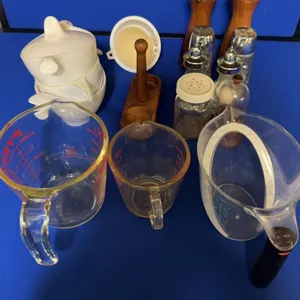 Assorted Kitchenware Lot Pyrex Measuring Cups Canisters and Grinders