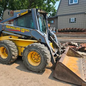 New Holland LS 190 Skid Steer with 77" Bucket and Track Kit, Diesel Engine, 2843 Hours on Meter, 10,000 Lb. Mass. Max