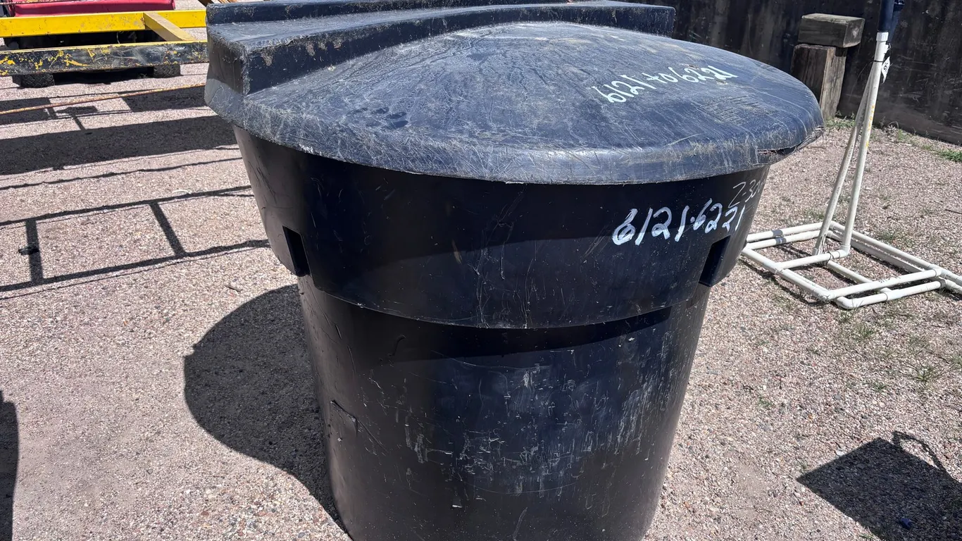 USED ROUND 300-GALLON TRASH CAN