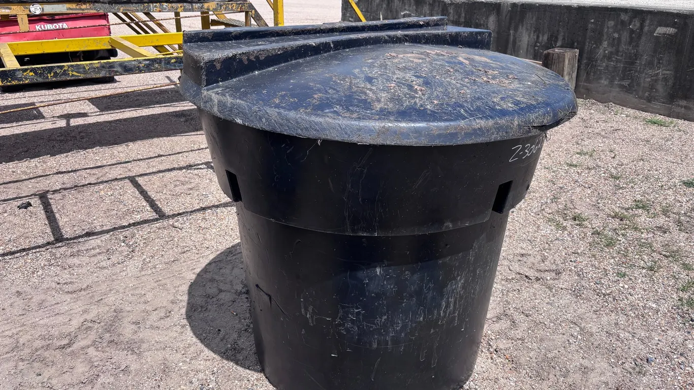 USED ROUND 300-GALLON TRASH CAN