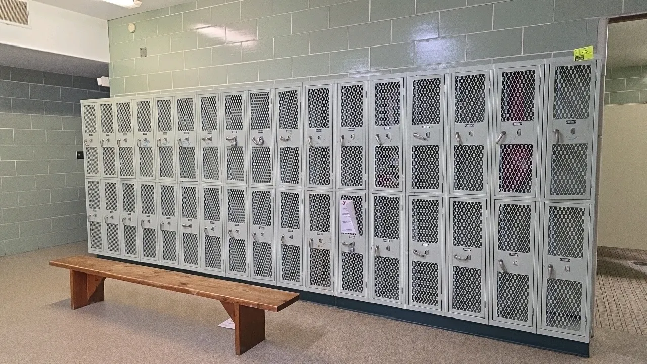 Interior Steel Equipment Co. 2-door metal lockers. Features ventilated diamond-mesh doors, interior hanging hooks, and latch handles with padlock loop