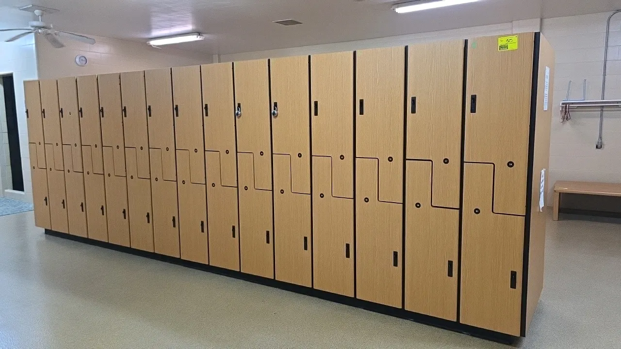 MultiSpace laminate wood 2-door lockers. Features a Z-door interlocking design, woodgrain laminate finish, interior hanging hooks, and recessed latch