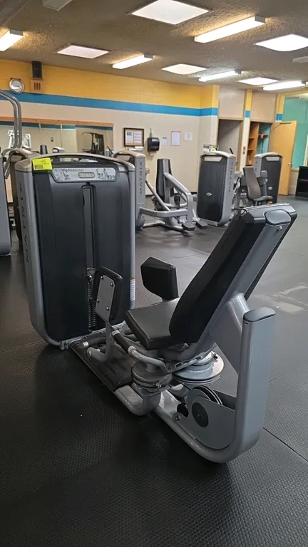 Matrix G7-S75 hip abductor exercise machine. Features a pin-selected weight stack up to 108 kg (240 lbs), adjustable padded knee pads, contoured black