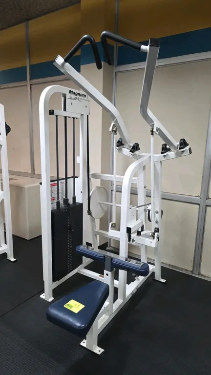 Magnum Fitness Systems Biangular Back Pulldown exercise machine. Features a selectorized 287.5 lb weight stack with pin, blue upholstered seat and adj