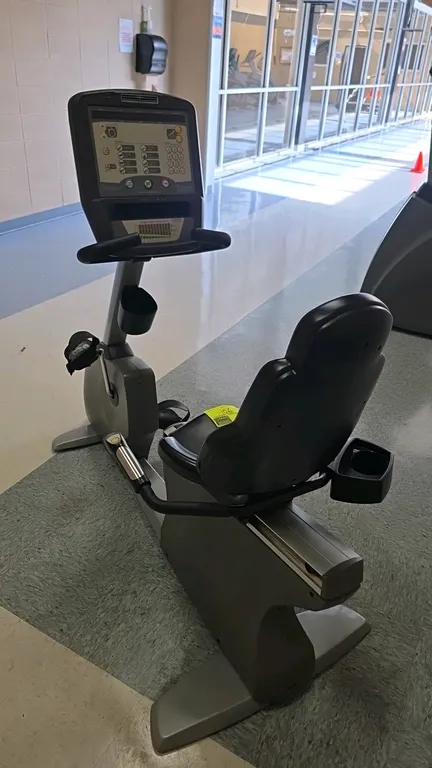 Matrix 3x/5x/7x Series recumbent exercise bike. Features an adjustable contoured seat with sliding track, console with LED display, multiple workout p
