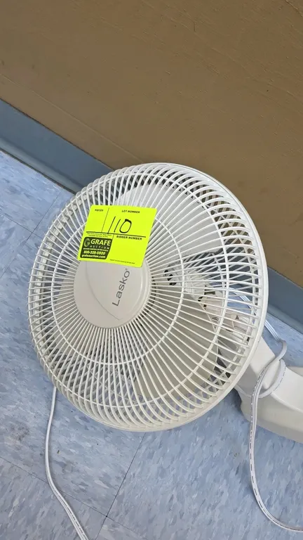 Lasko 3012 wall-mount fan. Features a 3-speed rotary control dial and pull cord. 14" diameter. Electrical: 120V, 60Hz, 0.65A. Integrated wall mounting