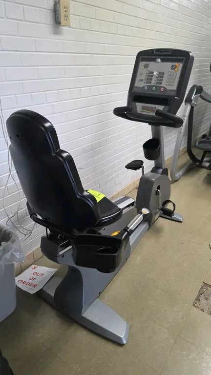 Matrix Fitness R-3x/5x/7x recumbent exercise bike. Features an adjustable padded seat with backrest, seat-side handlebars with integrated resistance c