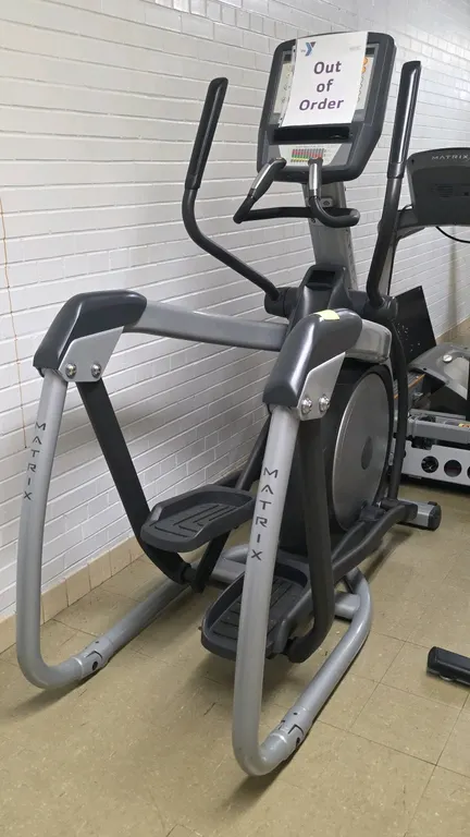 Matrix E-3x elliptical trainer. Features a digital console with integrated workouts, dual-action and stationary handlebars with contact heart rate sen