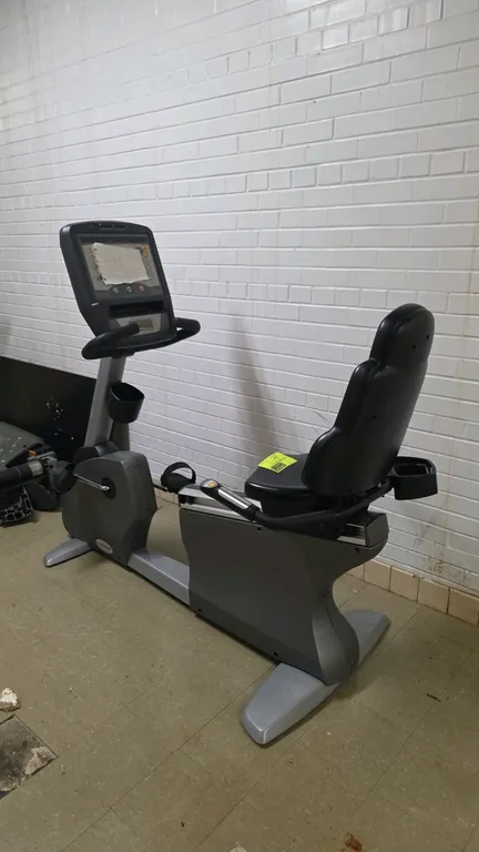 Matrix R-3x/5x/7x recumbent exercise bike. Features an adjustable contoured seat, pedals with straps, a digital display console, and seat-mounted hand