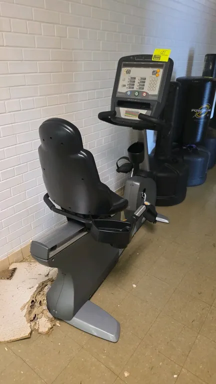 Matrix Fitness R-3x/5x/7x recumbent exercise bike. Features an adjustable contoured seat with armrests, LED console with multiple workout programs, nu