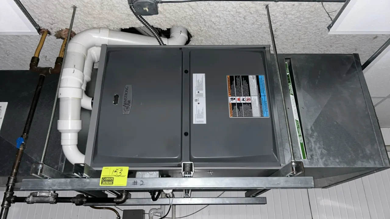 Armstrong Air high-efficiency condensing gas furnace. Features a horizontal configuration with PVC venting and a filter slot. Fits a 20" x 25" x 1" fi