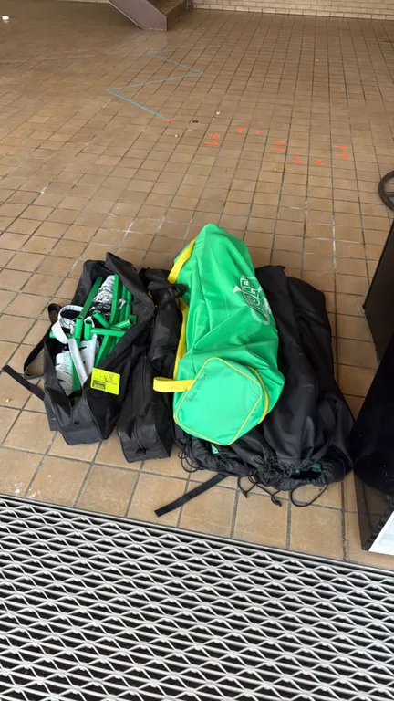 Assorted kids portable sports net systems. Includes green metal poles, nets, and multiple carrying bags, featuring a Yolo Sports branded bag. Note: Un