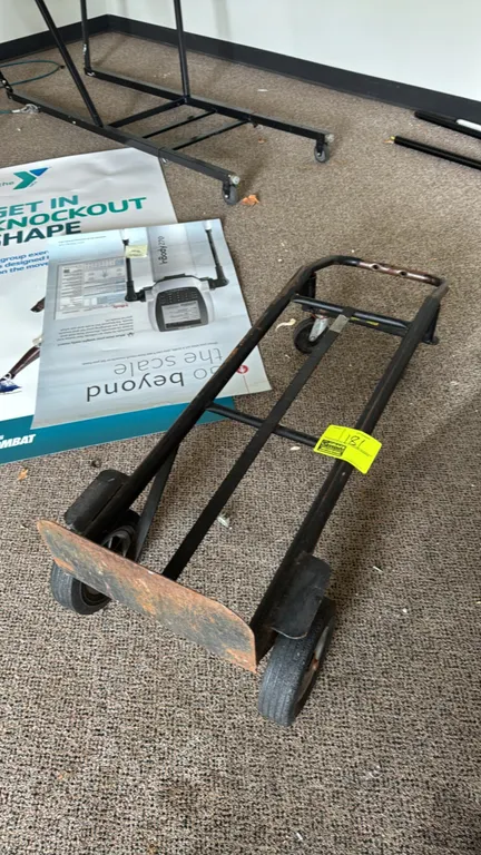 Convertible 2-in-1 metal hand truck dolly. Converts from a 2-wheel upright hand truck to a 4-wheel horizontal utility cart. Features a tubular steel f