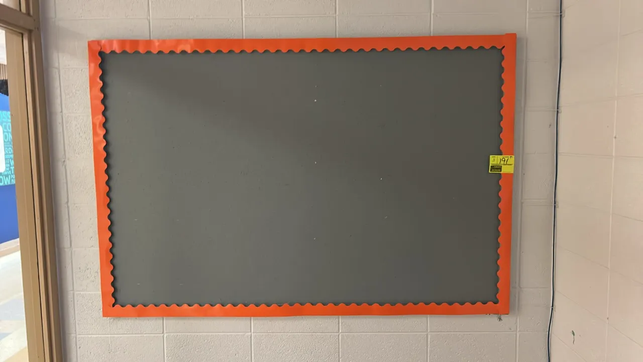 Assorted sized corkboards. Includes three bulletin boards in various sizes. One board features an orange scalloped border, one features a standard woo