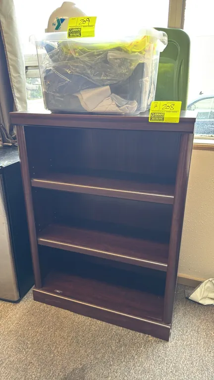 Laminate bookcases. Features a dark woodgrain laminate finish with two adjustable shelves and a fixed bottom shelf. Dimensions: 30"x13"x40" each. Cont
