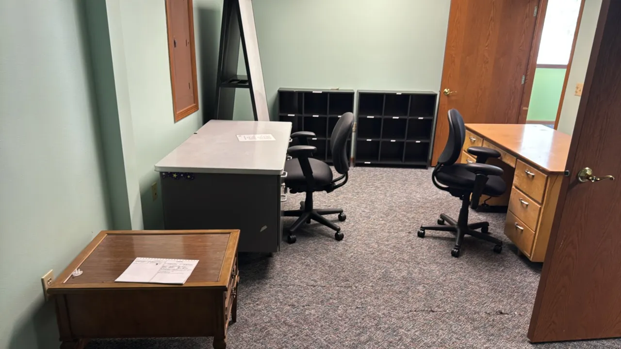 Office package. Includes (1) wooden single-pedestal desk, (1) gray metal single-pedestal desk, (2) black fabric adjustable office chairs on casters, (