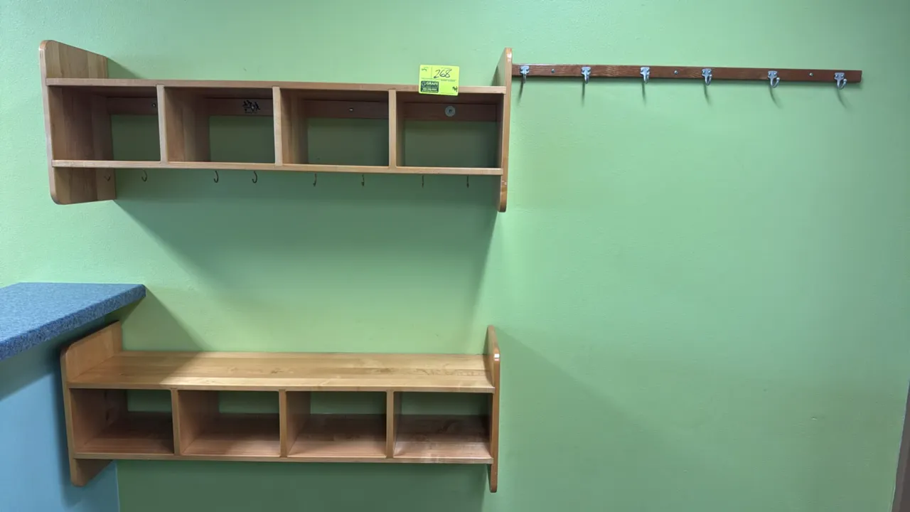 Wood wall cubby and coat rack set. Includes (2) wall-mounted cubby units with 4 compartments each and (1) wall-mounted coat rack strip with 6 metal ho