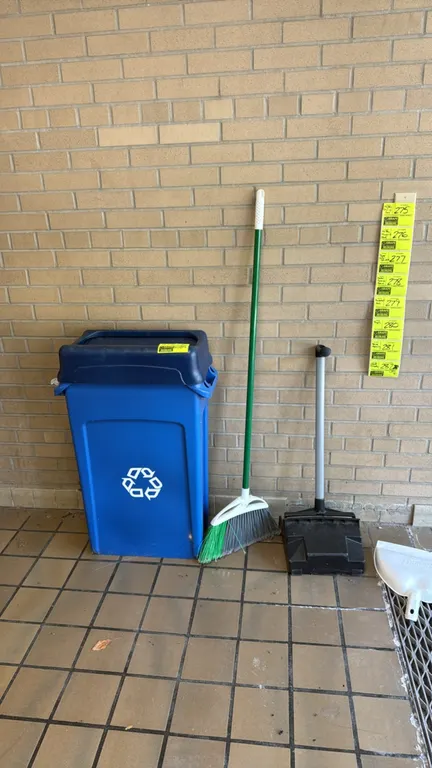 Blue poly recycling can and cleaning accessories. Includes a blue plastic recycling bin with a dark blue lid and white recycling logo, an upright broo