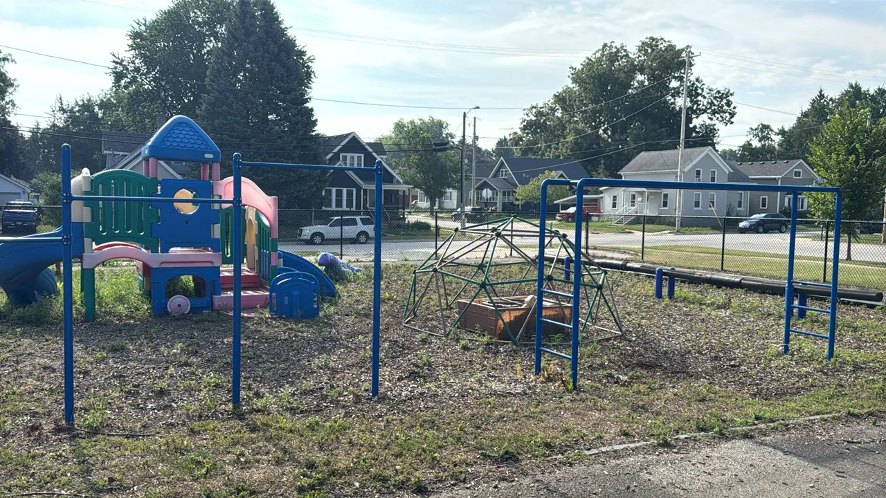Blue metal playground equipment. Includes one double pull-up bar assembly and one overhead monkey bar assembly. Constructed of powder-coated steel. Pu